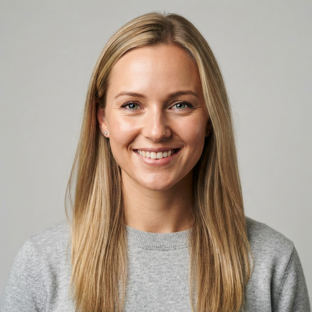 Member with blonde hair in a grey sweater
